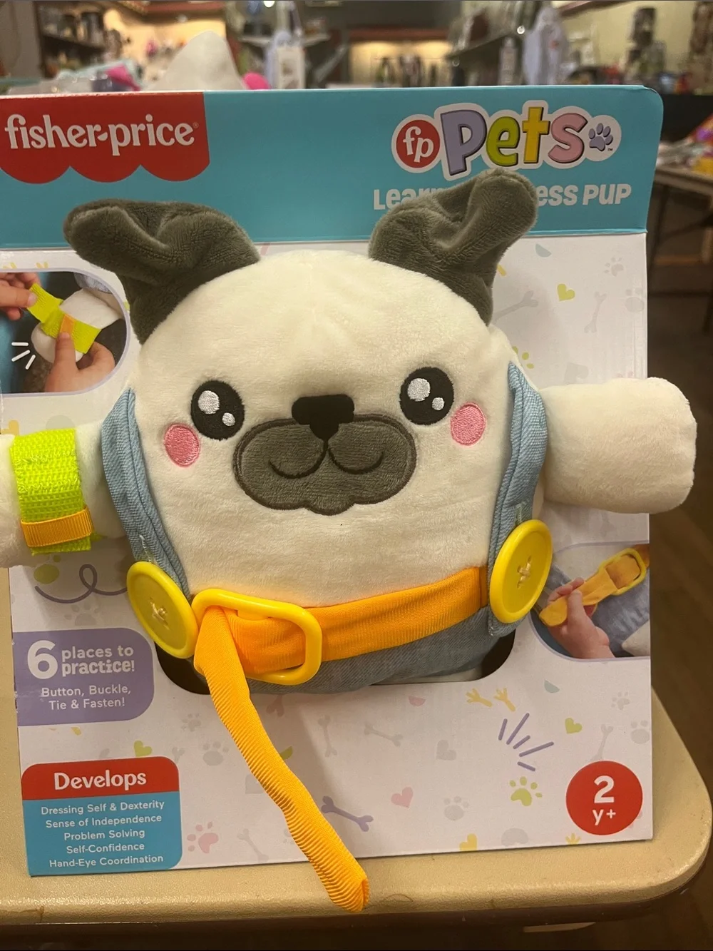 Fisher-Price Plush Puppy Dressing Skills Bib in Cream, Yellow, Gray, Pink